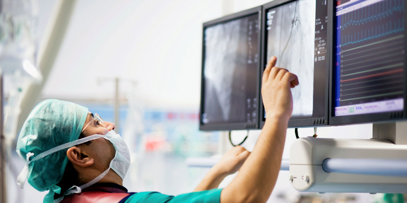 Surgeon looking at x-rays
