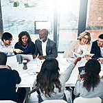 Shot of a group of diverse group of people having a meeting in a modern office.