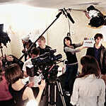 A movie crew shooting a movie in studio.